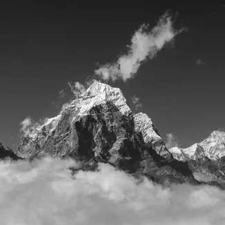 Taboche Peak (6505 m) of the Khumbu Region (Everest Region) in Nepal. Cho Oyu, the world's sixth-highest mountain is in the background. View from the moraine hight above the Ama Dablam Base Camp. Solukhumbu, Himalayas. Copyright: Radek Kucharski. Prints of this photograph are available at FineArtAmerica and Pixels.com.